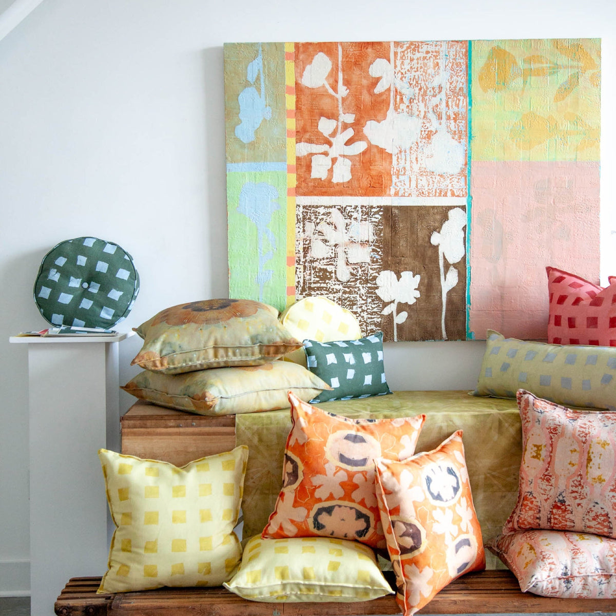 Les Fleurs pillow styled with other Teresa Roche Textiles pillows in the Greenville studio