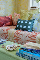 Modernity (Preppy) lumbar, Modernity (Sachet) round and Palmetto pillows on a sofa, detail